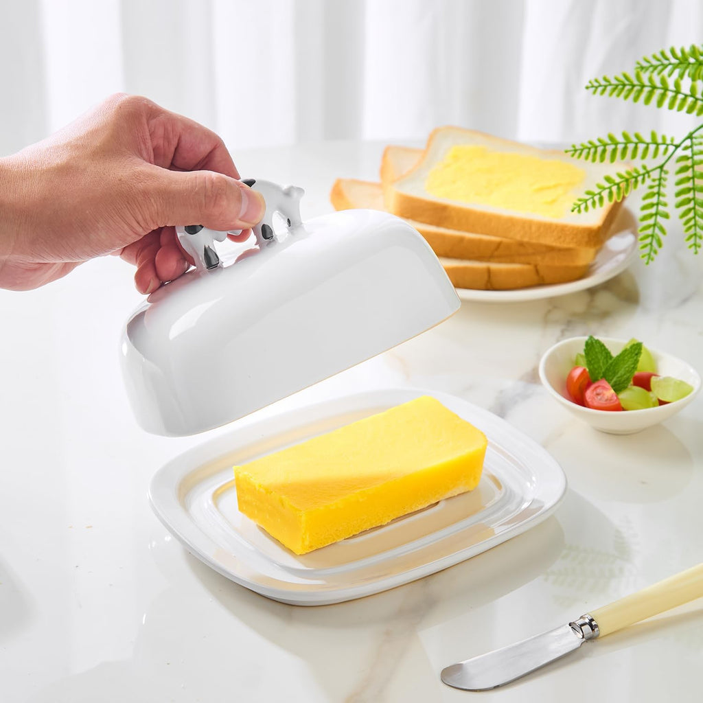 Butter Dish with Lid for Countertop, 7.8" x 6.3" Large Ceramic Butter Keeper Container with Cow Handle, White Butter Holder Tray for East West Coast Butter Stick, Microwave & Dishwasher Safe